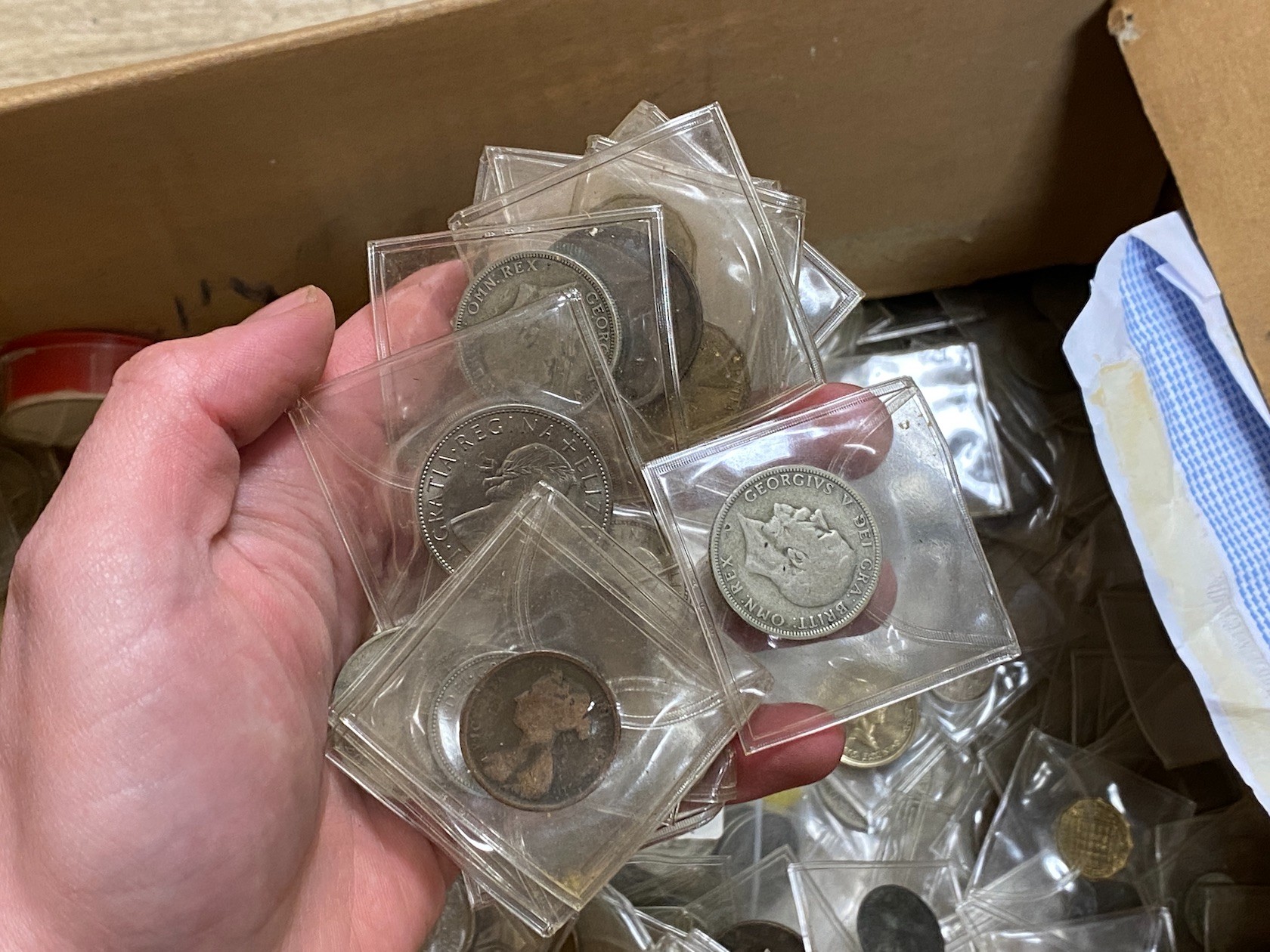 A box of assorted coins, mostly George V to QEII